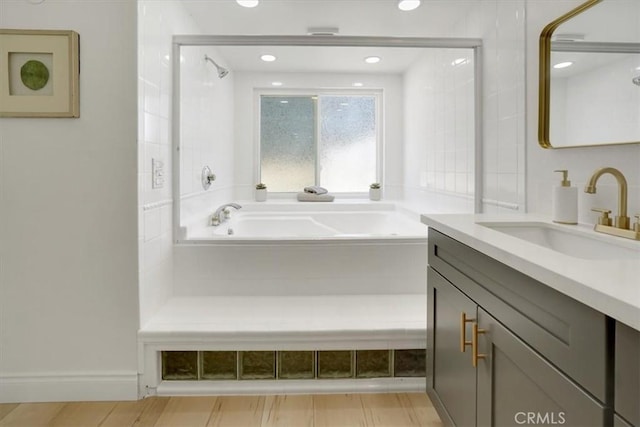 bathroom with vanity and a bathing tub