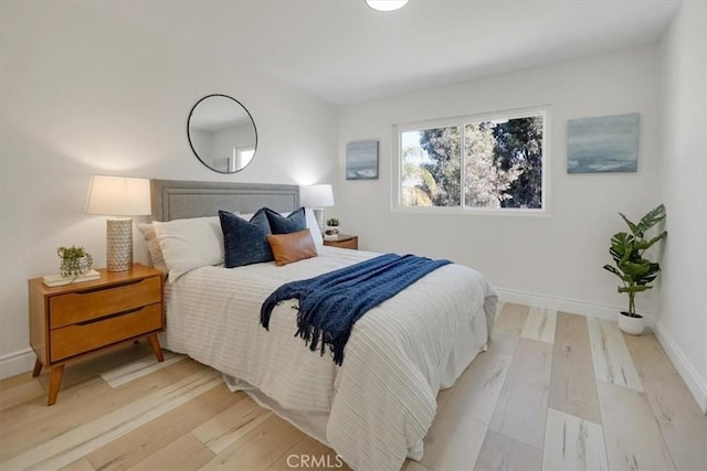 bedroom with light wood-type flooring