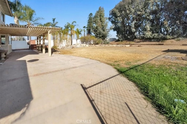 view of yard with a pergola and a patio area