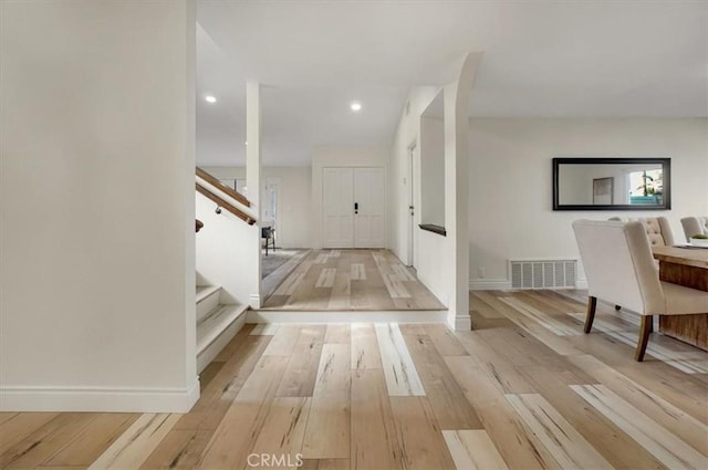 corridor with light wood-type flooring