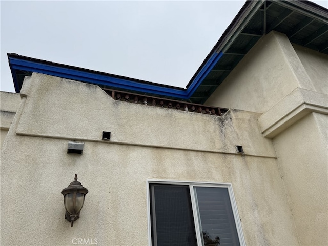 view of property exterior with stucco siding