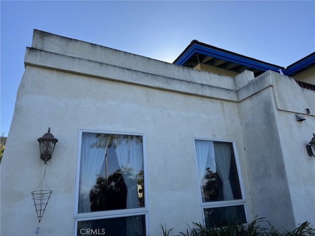 view of side of property featuring stucco siding