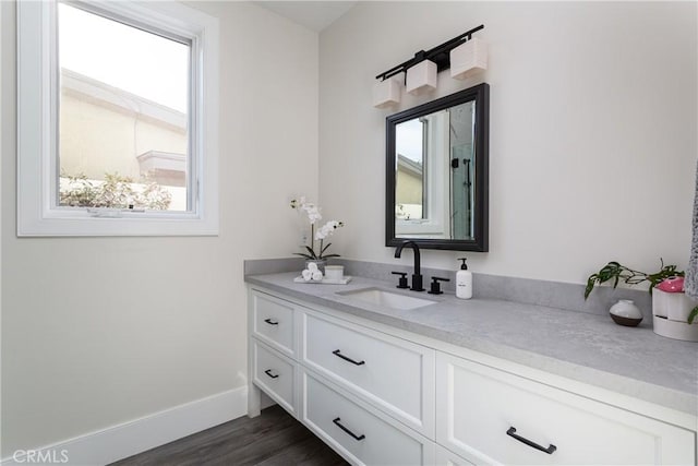 bathroom featuring vanity and hardwood / wood-style floors