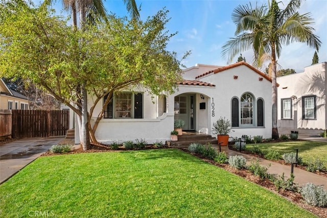 mediterranean / spanish house with a front lawn