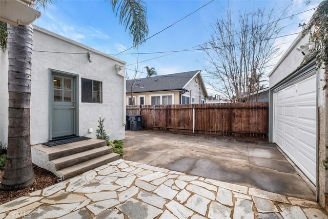 view of patio / terrace featuring a garage