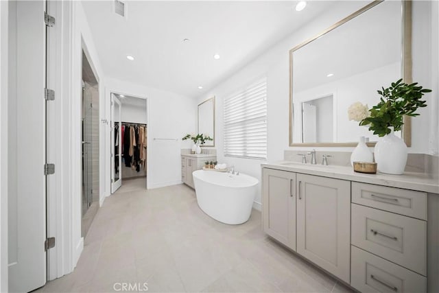 bathroom with vanity, separate shower and tub, and tile patterned floors