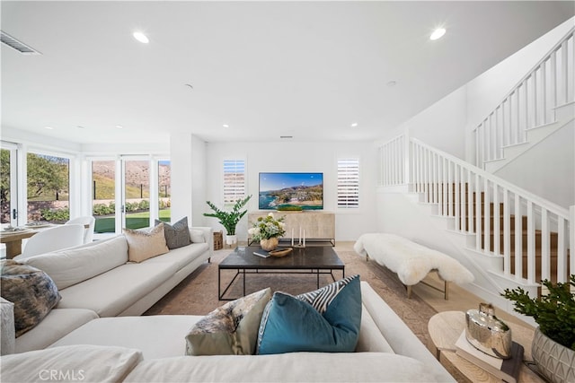 living room featuring plenty of natural light