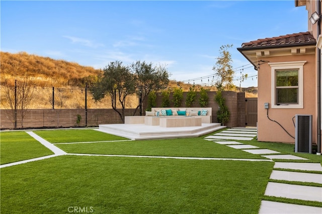 view of yard featuring cooling unit and an outdoor living space