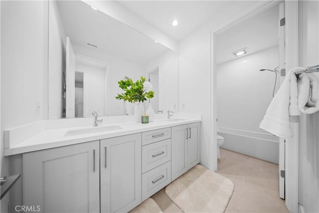 full bathroom featuring shower / bath combination, vanity, tile patterned floors, and toilet