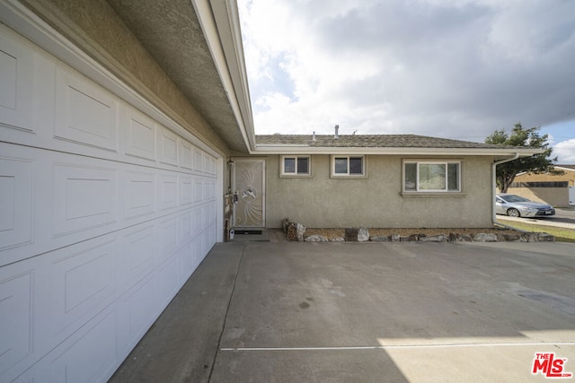 view of property exterior featuring a garage