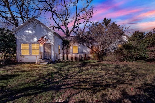 view of front of property with a yard