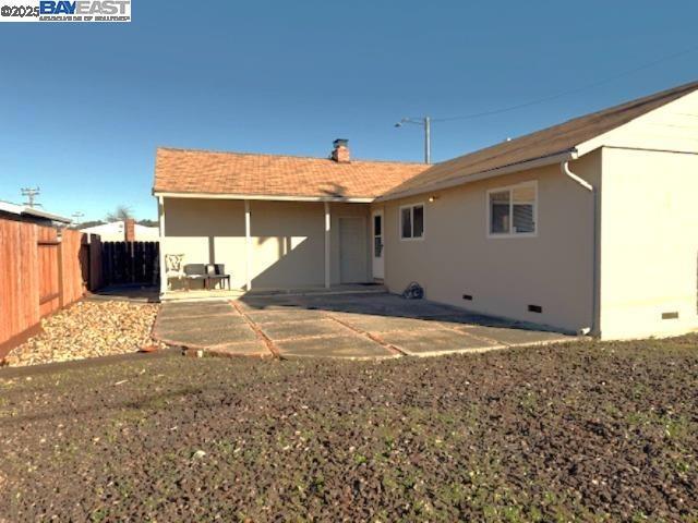 rear view of property featuring a patio