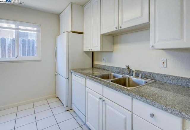 kitchen featuring sink, white cabinetry, light tile patterned floors, and dishwasher