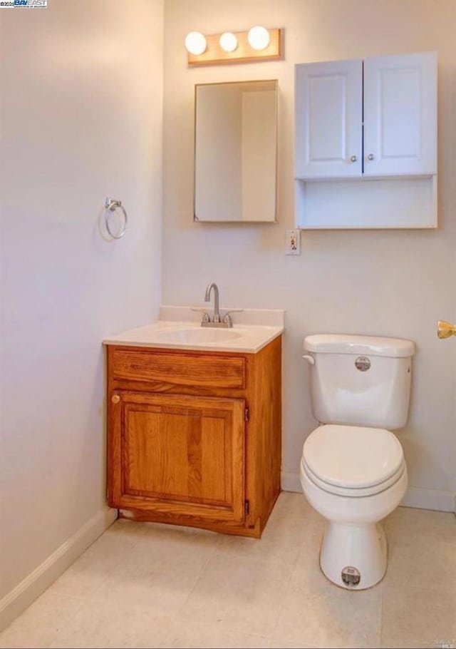 bathroom with toilet and vanity