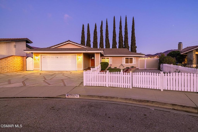 ranch-style house featuring a garage