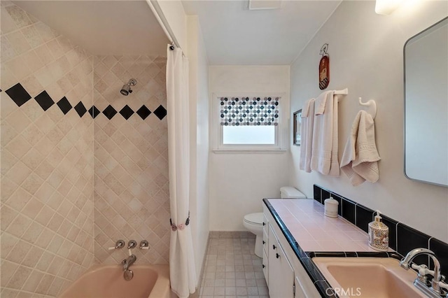 full bathroom featuring toilet, vanity, and shower / bath combo with shower curtain