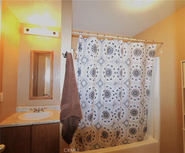 bathroom with vanity and shower / bath combination with curtain