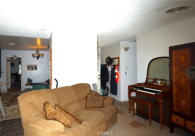 living room featuring carpet flooring and a textured ceiling