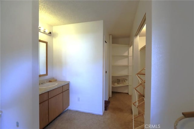 bathroom featuring vanity and a textured ceiling