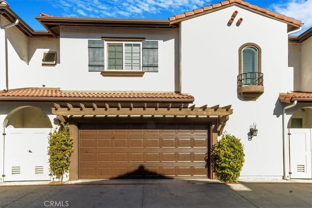 mediterranean / spanish house featuring a garage