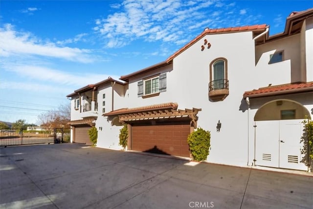 mediterranean / spanish house featuring a garage