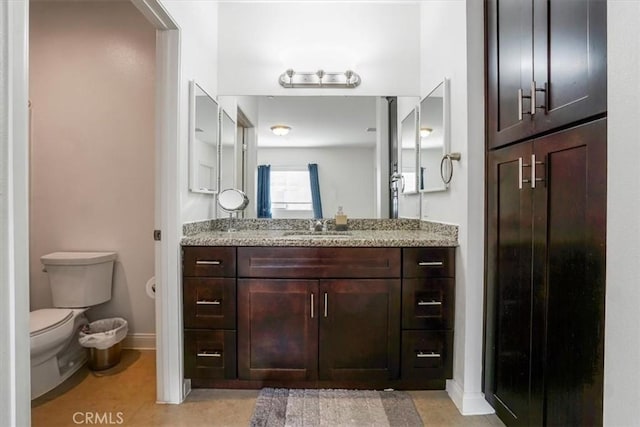 bathroom with toilet and vanity