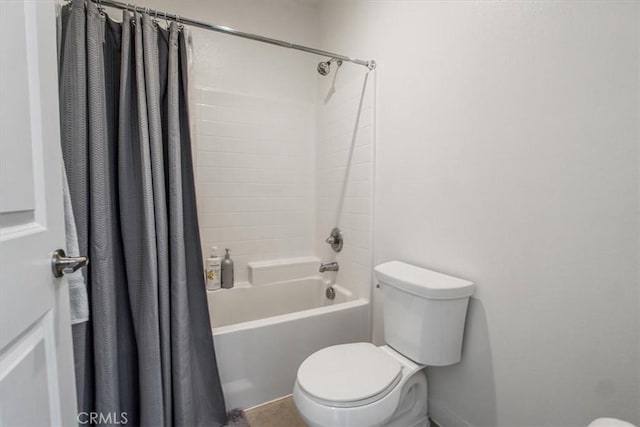 bathroom featuring toilet and shower / bathtub combination with curtain