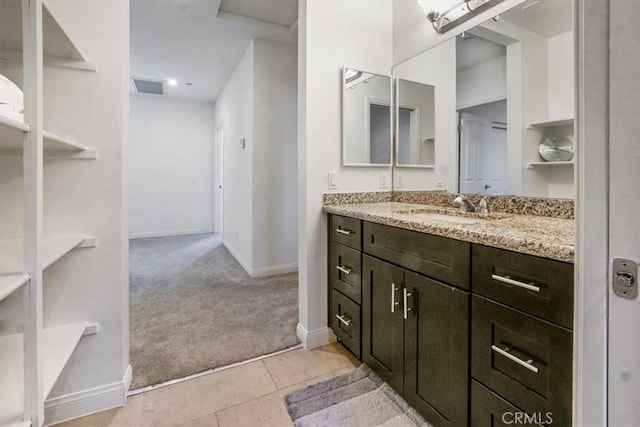 bathroom with tile patterned flooring and vanity