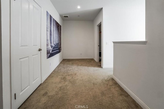 hall featuring carpet