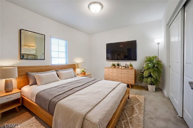 carpeted bedroom with a closet