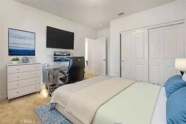 bedroom with light carpet and a closet