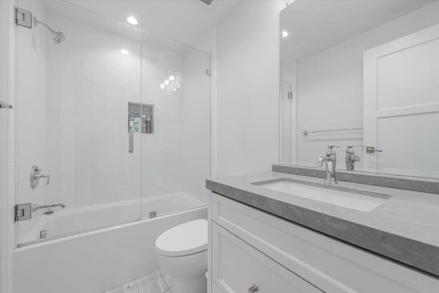 full bathroom with vanity, enclosed tub / shower combo, and toilet