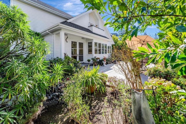 view of property exterior featuring a patio area