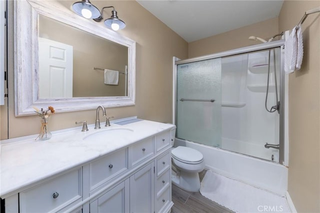 405 W Mountain View Ave Unit 11, La Habra, CA 90631 - bathroom with combined bath / shower with glass door, vanity, toilet, and wood finished floors