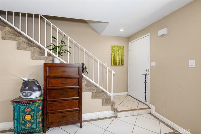 entrance foyer with light tile patterned flooring