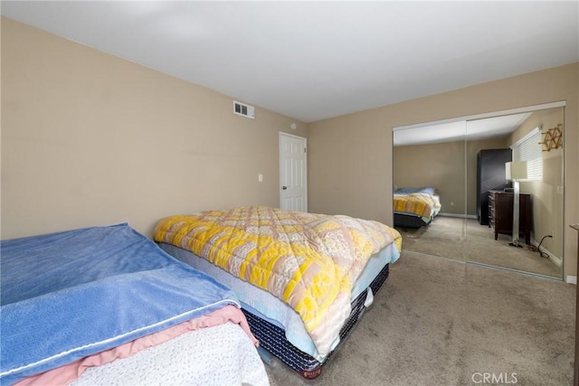 carpeted bedroom featuring a closet