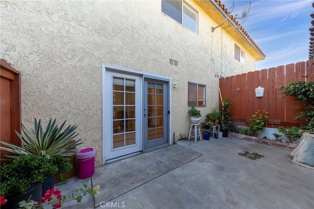 property entrance with a patio