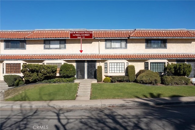 405 W Mountain View Ave Unit 11, La Habra, CA 90631 - view of front of property with stucco siding, a front lawn, and a tile roof