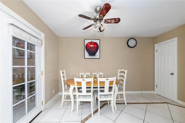 unfurnished dining area featuring light tile patterned flooring and ceiling fan