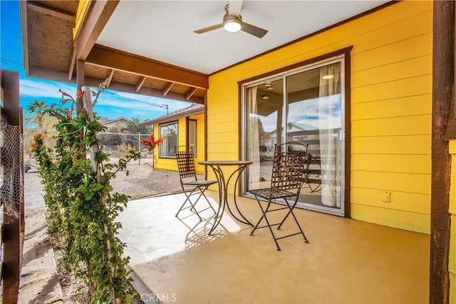 view of patio featuring ceiling fan