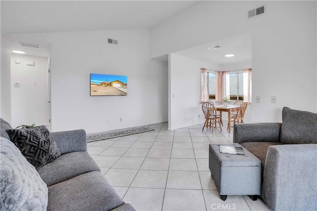 tiled living room with vaulted ceiling