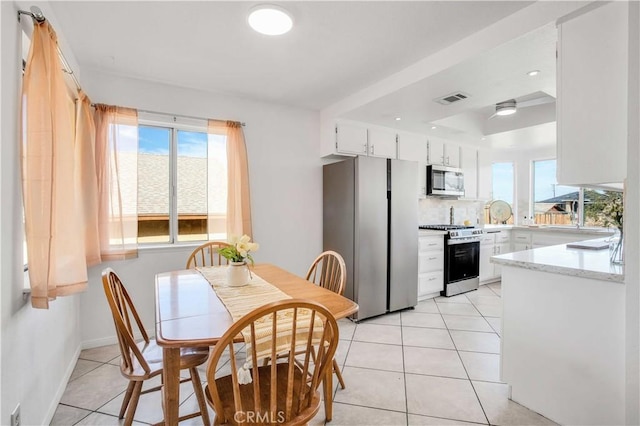 tiled dining area with sink