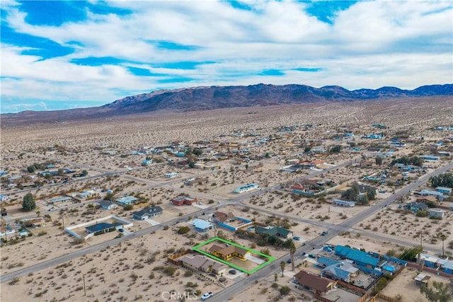 drone / aerial view featuring a mountain view