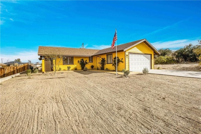 single story home featuring a garage