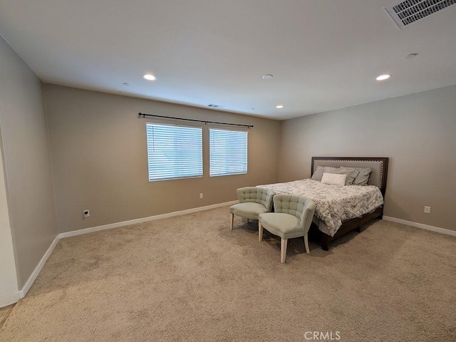 bedroom featuring light carpet