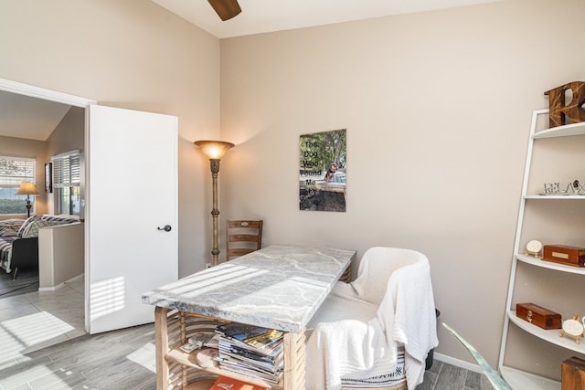 dining area featuring ceiling fan and lofted ceiling