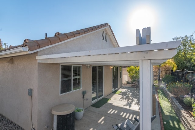 rear view of house with a patio area and central air condition unit