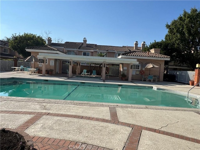 view of pool featuring a patio area