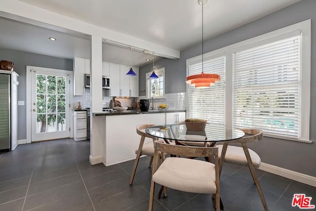 tiled dining space with sink