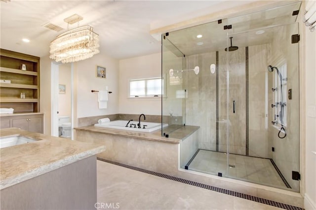 full bathroom featuring toilet, sink, plus walk in shower, built in shelves, and a chandelier